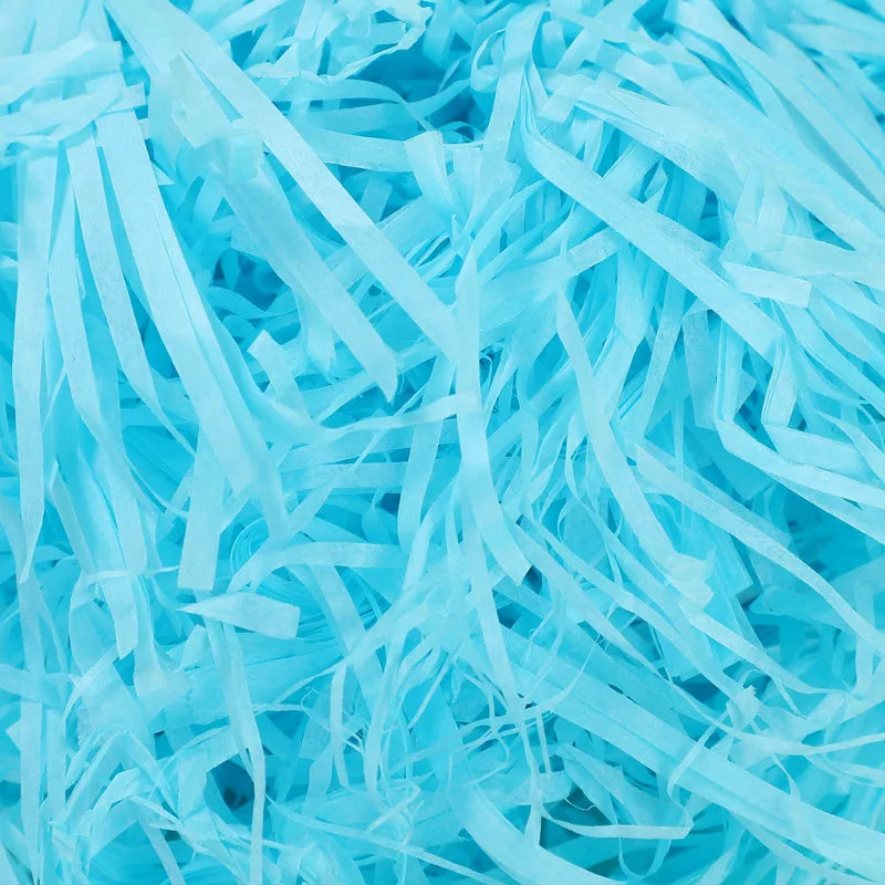 Riempimento per scatole regalo di caramelle in carta crespa triturata color rafia.