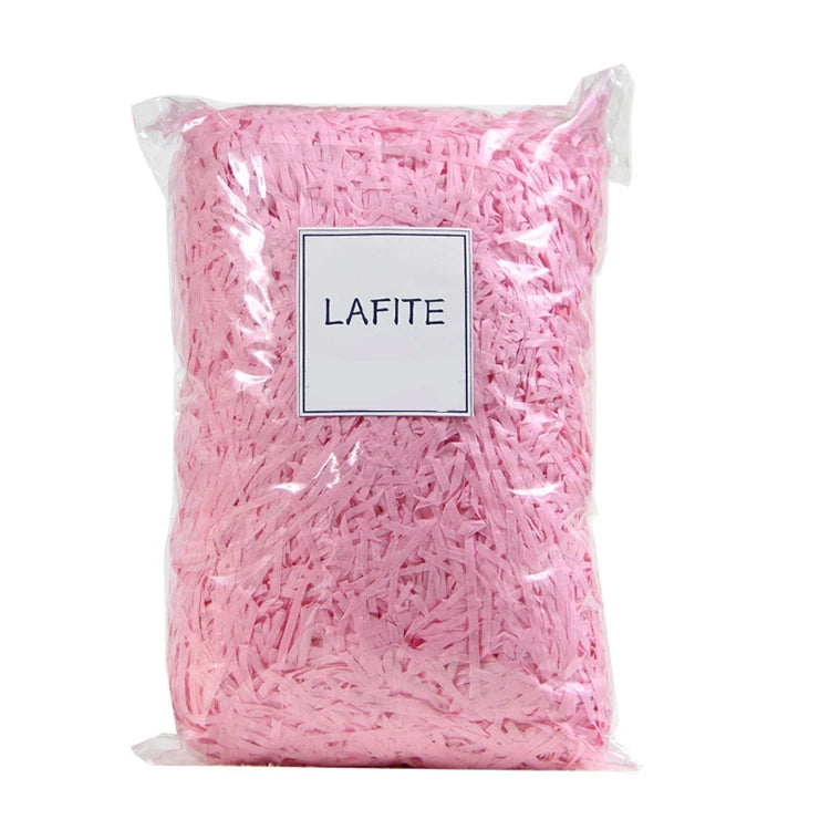 Riempimento per scatole regalo di caramelle in carta crespa triturata color rafia.