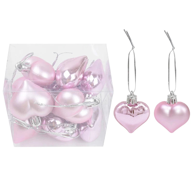 Adorno de bolas navideñas de plástico en caja, en colores rosa y dorado surtidos.