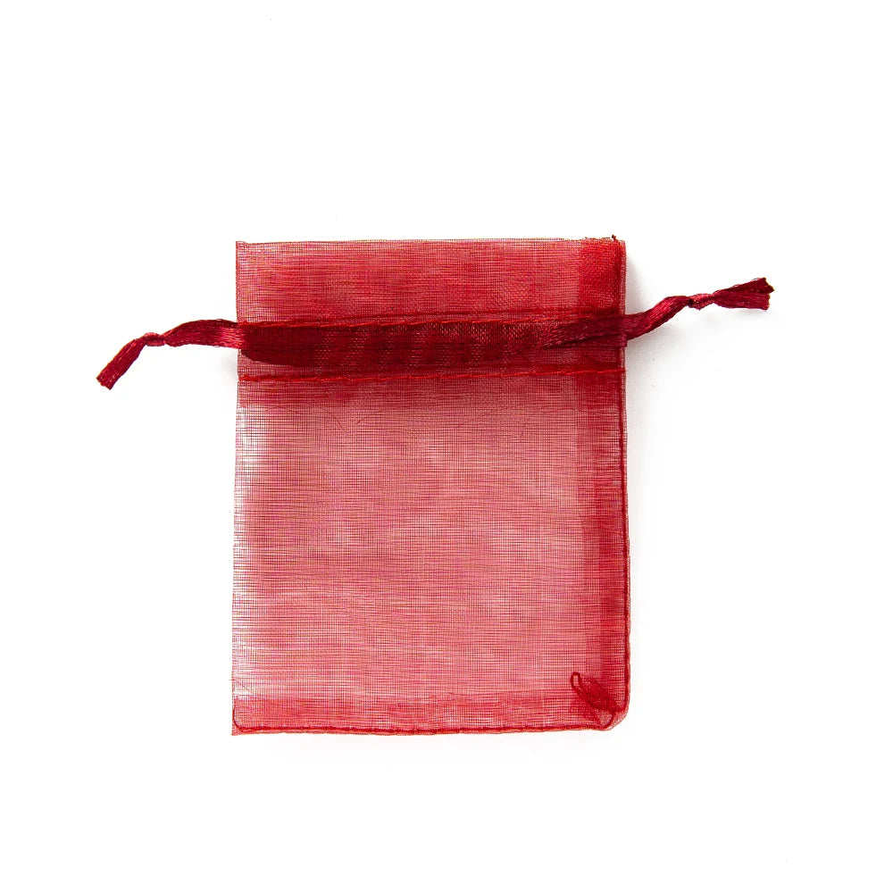 Sacchetti regalo con coulisse color oro e colorati per eventi.