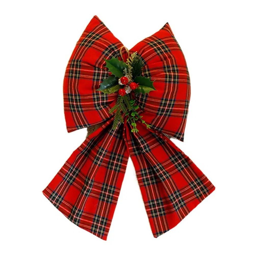 Decorazione natalizia con fiocchi rossi di grandi dimensioni per la punta dell'albero.