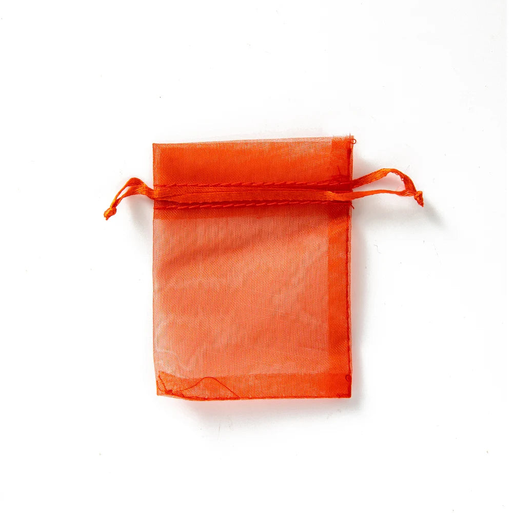 Sacchetti regalo con coulisse color oro e colorati per eventi.