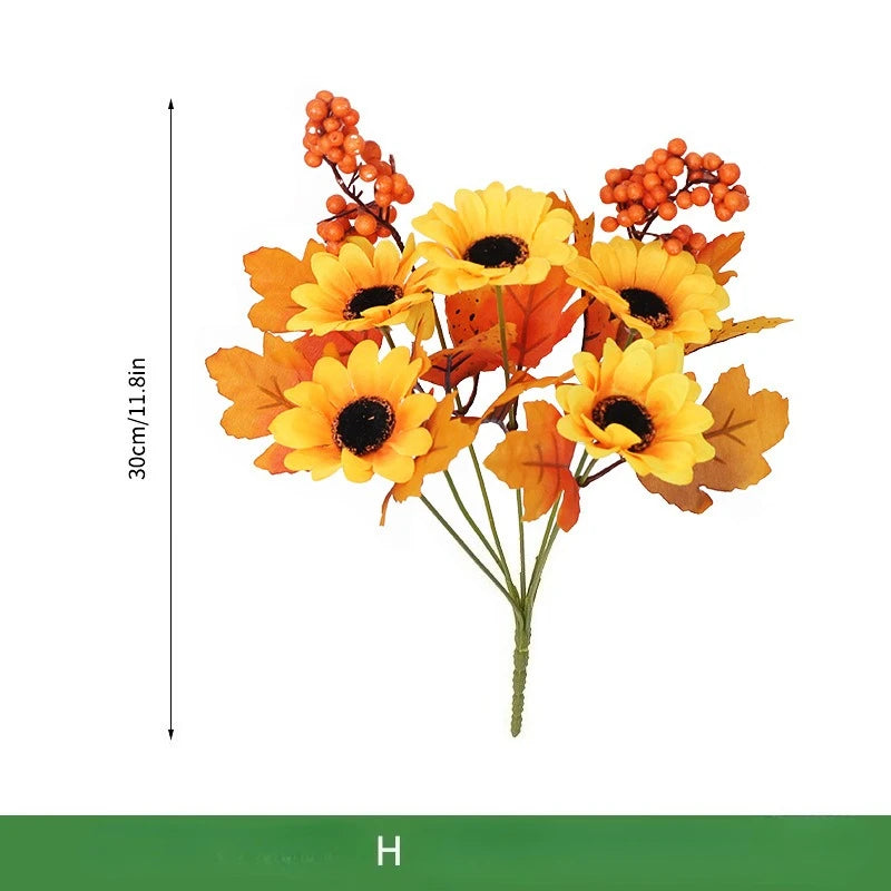 Ramo navideño de naranjas, girasoles artificiales y hojas de arce