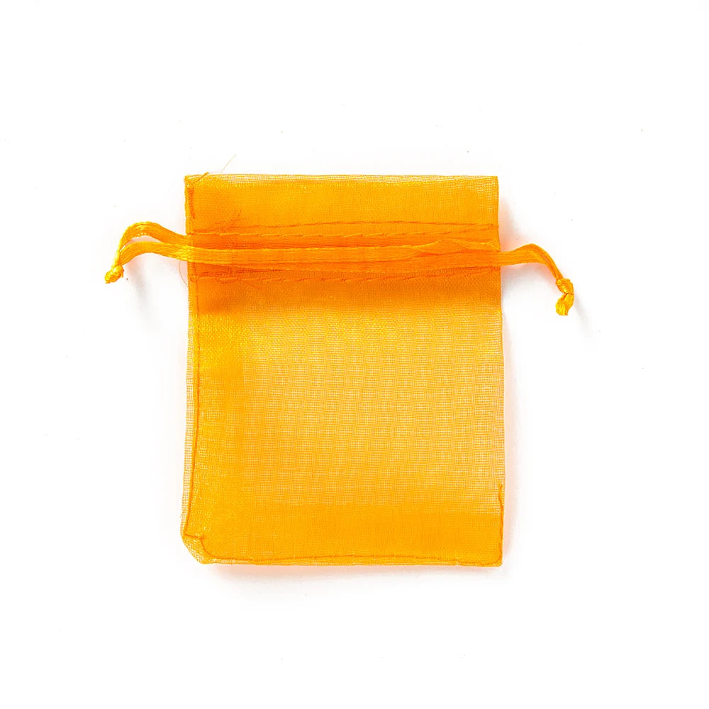 Sacchetti regalo con coulisse color oro e colorati per eventi.