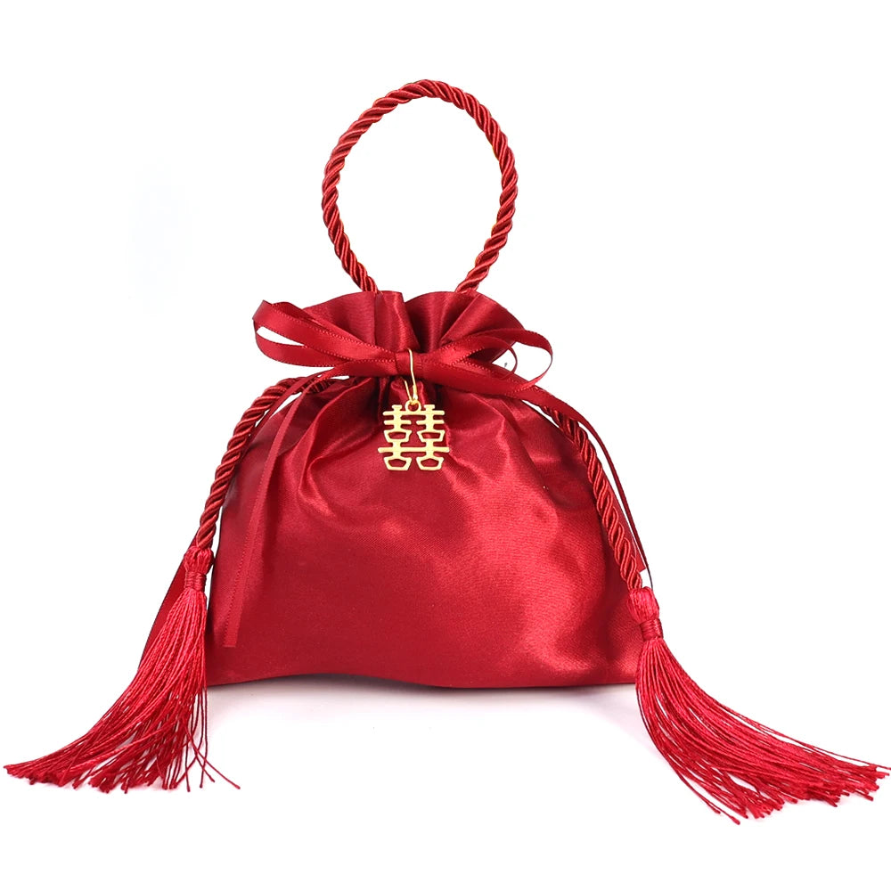 Sacchetto di stoffa con coulisse per i regali degli ospiti delle nozze, colore rosso.