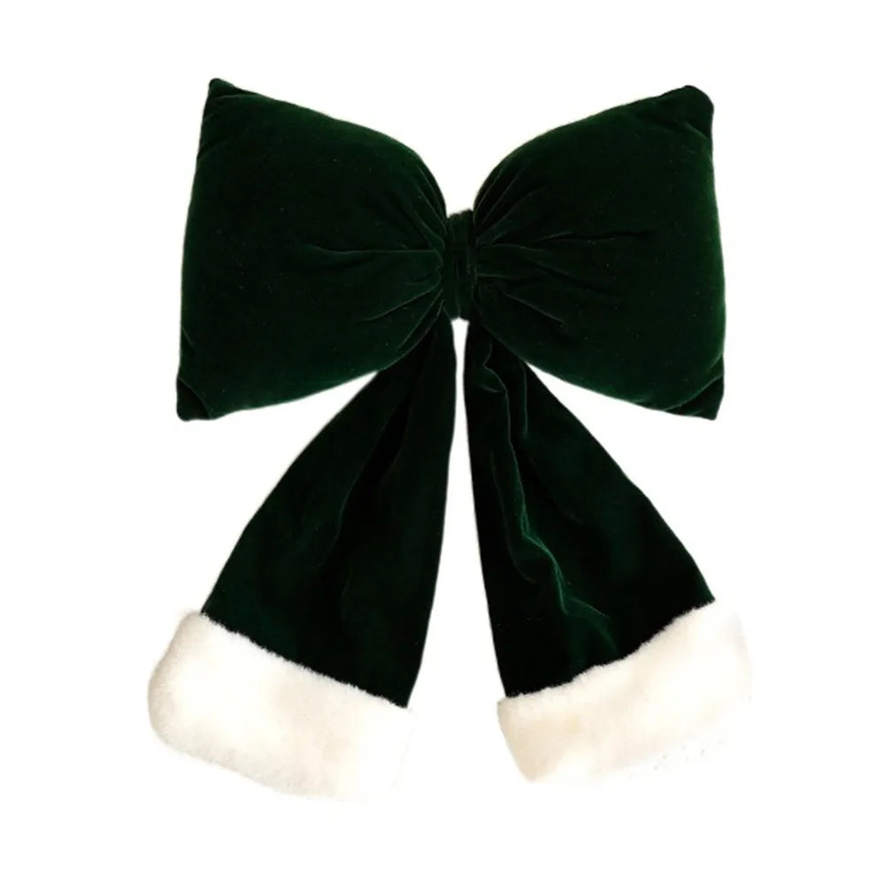 Decorazione natalizia con fiocchi rossi di grandi dimensioni per la punta dell'albero.