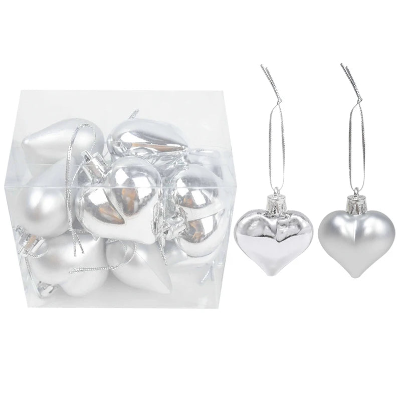 Adorno de bolas navideñas de plástico en caja, en colores rosa y dorado surtidos.