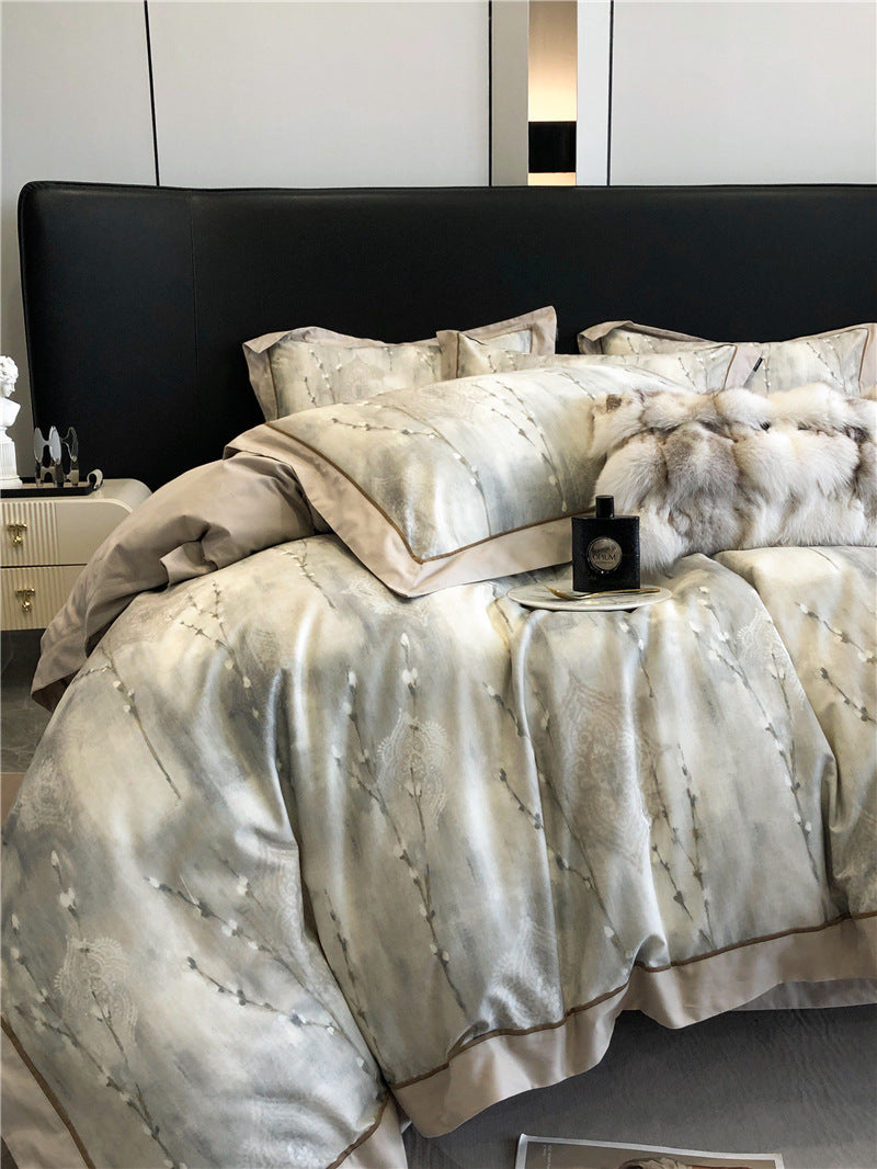 Set di biancheria da letto composto da quattro pezzi in cotone a fibra lunga.